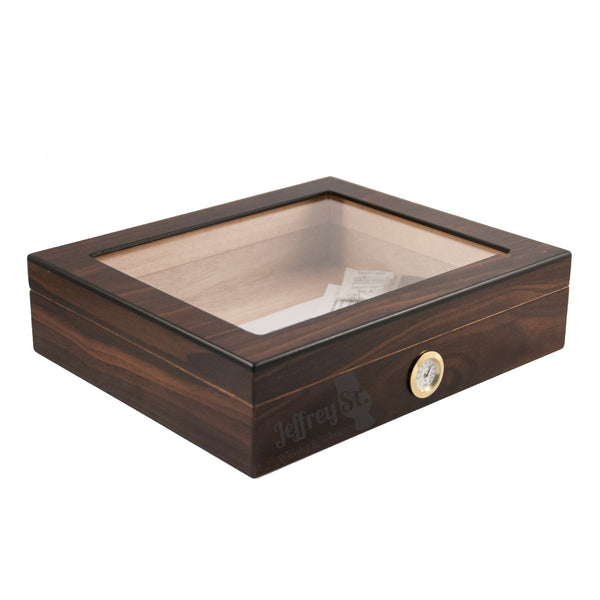 A brown stained wood humidor for 20 cigars with a glass top